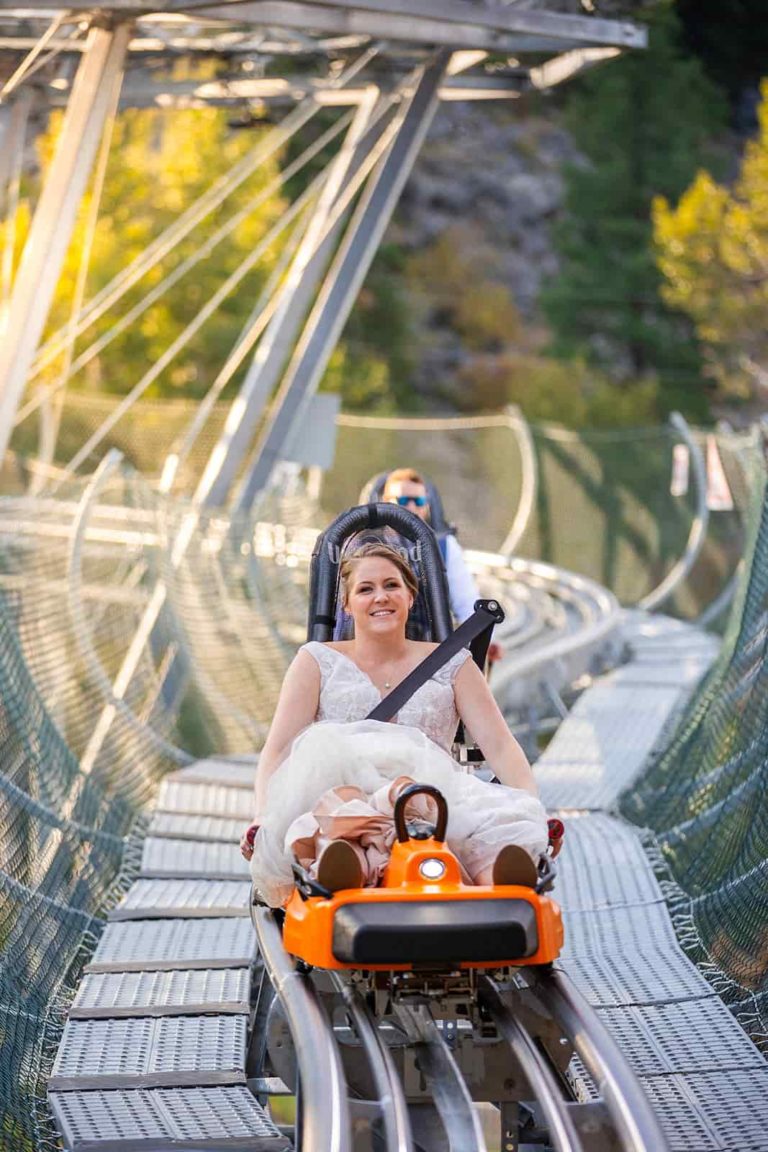 Talk about cool things to do during your elopement... this bride is riding a rollercoaster in her wedding dress!