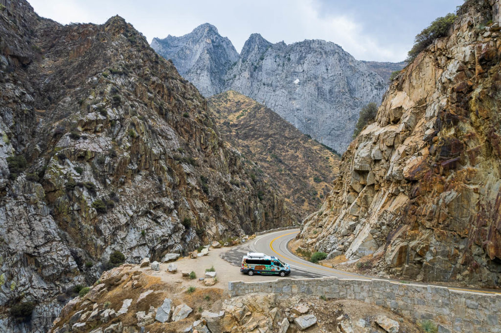 An Escape Campervan along the road in a rocky canyon