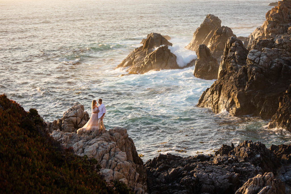 A couple embrace overlooking the ocean during their Big Sur elopement.