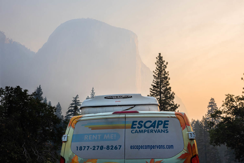 An escape campervan in front of el cap in Yosemite National Park at sunrise