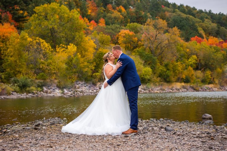 A couple share their first kiss during their Devil's Lake elopement at Devil's Lake State Park in Wisconsin.