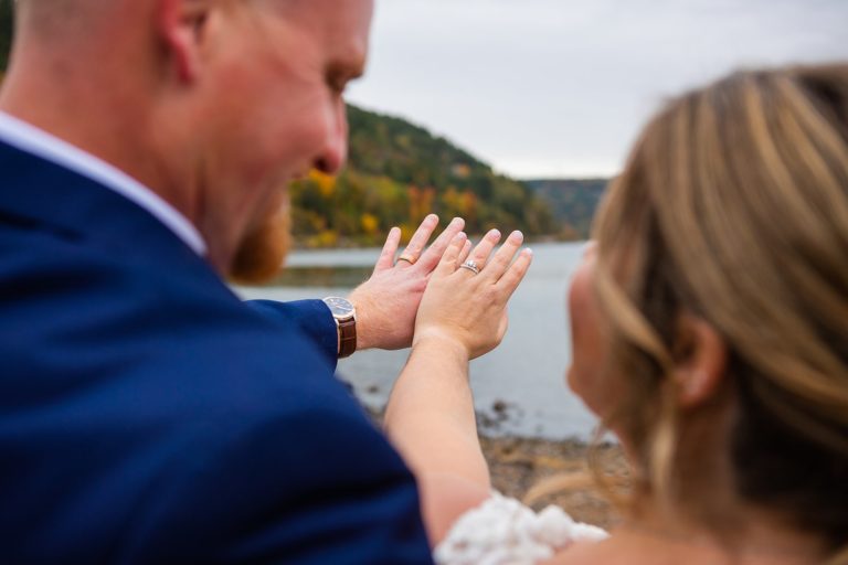 A newly married couple admires their wedding rings during their Devil's Lake elopement.