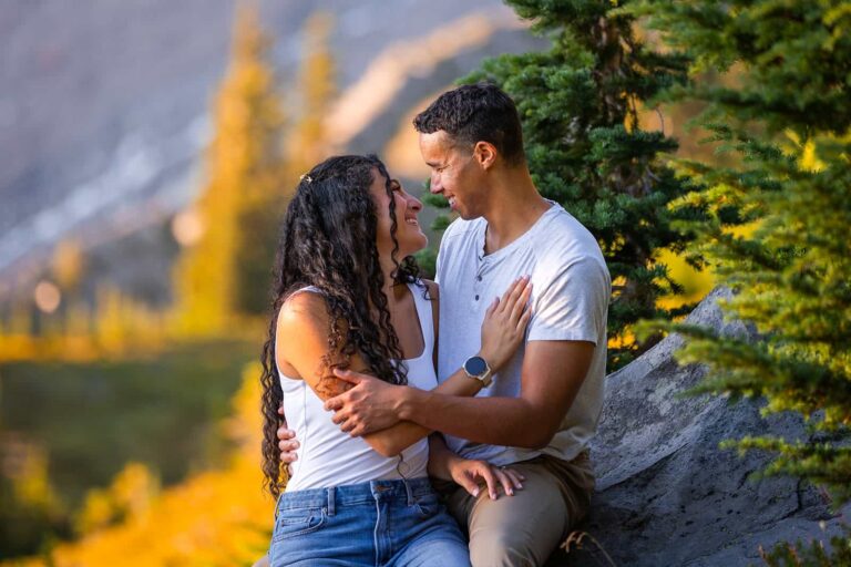 A newly engaged couple stare into one another's eyes during their fall engagement session at Mount Rainier National Park in Washington.