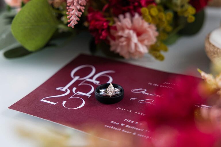 Detail photos of an invitation for a wedding at Pier B.