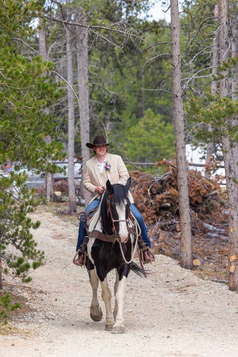 A groom rides one of the Spear-O-Wigwam horses down the aisle at his wedding.