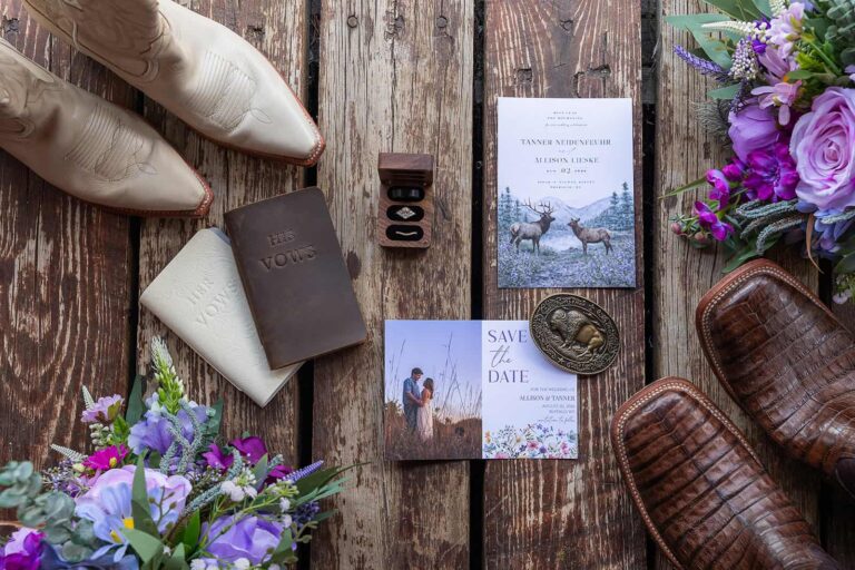Wedding details from a western wedding are set out on a wooden porch.